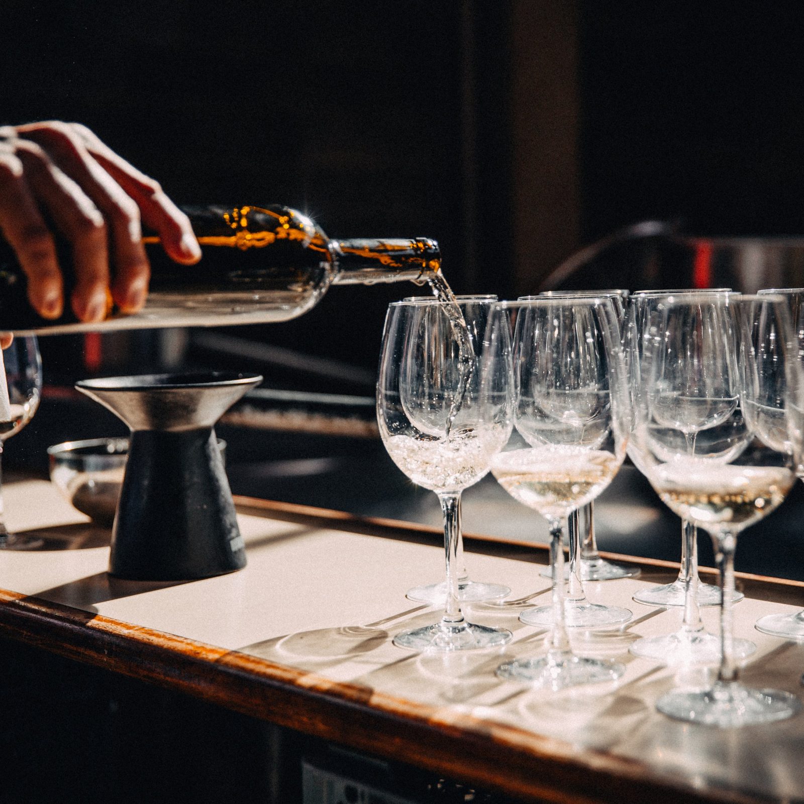 filling-wine-glasses-on-counter-1600x1600